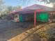 Unique house featuring a colorful carport design and colorful doors at 6528 N Hillside Dr, Paradise Valley, AZ 85253