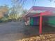 Charming house featuring a unique carport design and colorful doors at 6528 N Hillside Dr, Paradise Valley, AZ 85253