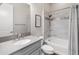 Bright bathroom with a gray vanity, sleek fixtures, and a shower-tub combination with stylish tile at 70 E Kennedia Dr, Queen Creek, AZ 85140