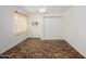 Cozy bedroom featuring a ceiling fan, window with curtains, and carpet at 7335 W Mission Ln, Peoria, AZ 85345