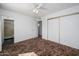 Bedroom with ceiling fan, plush carpet, and closet at 7335 W Mission Ln, Peoria, AZ 85345