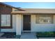 A secure front entrance with security door, adjacent to landscaped yard, and well lit at 7335 W Mission Ln, Peoria, AZ 85345