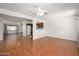 Open concept living space with wood floors seamlessly connects to the kitchen at 7335 W Mission Ln, Peoria, AZ 85345