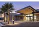 Beautifully lit building entrance with modern design, palm trees, and well-maintained landscaping at 7705 E Doubletree Ranch Rd # 29, Scottsdale, AZ 85258