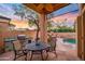 Inviting outdoor patio with a built-in barbecue, cozy seating area, and a view of the desert landscape at 7705 E Doubletree Ranch Rd # 29, Scottsdale, AZ 85258