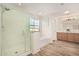 Bright bathroom with glass shower, soaking tub and double sink at 7910 W Spur Dr, Peoria, AZ 85383