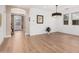 Open dining area with wood floors, natural light, and decorative lighting fixture at 7910 W Spur Dr, Peoria, AZ 85383