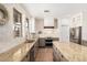 Bright kitchen featuring granite countertops, stainless steel appliances, and a large island for prepping at 7910 W Spur Dr, Peoria, AZ 85383