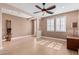 Open-concept living room featuring tile floors, recessed lighting, and a ceiling fan at 7910 W Spur Dr, Peoria, AZ 85383