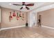 Open-concept living room featuring tile floors, recessed lighting, and a ceiling fan at 7910 W Spur Dr, Peoria, AZ 85383