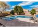 Beautiful backyard pool with surrounding patio, ideal for outdoor enjoyment and lounging in the sun at 7910 W Spur Dr, Peoria, AZ 85383