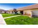 Townhouse featuring a well-manicured lawn and inviting walkway to the front door at 8101 N 107Th Ave # 23, Peoria, AZ 85345