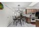 Kitchen/Dining area featuring tile floors, cabinets, and table with chairs at 8101 N 107Th Ave # 23, Peoria, AZ 85345