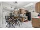 Kitchen/Dining area featuring tile floors, cabinets, and table with chairs at 8101 N 107Th Ave # 23, Peoria, AZ 85345