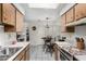 Kitchen/Dining area featuring tile floors, cabinets, and table with chairs at 8101 N 107Th Ave # 23, Peoria, AZ 85345