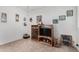 Living room featuring carpet, a ceiling fan, and a decorative media center at 8101 N 107Th Ave # 23, Peoria, AZ 85345