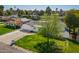 High aerial view of a home with a well-manicured lawn and mature trees at 829 E Desert Park Ln, Phoenix, AZ 85020