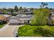 Aerial view of a home with a well-manicured lawn and mature trees at 829 E Desert Park Ln, Phoenix, AZ 85020