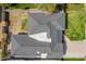 An aerial top-down shot of a house with a gray roof, and a well maintained yard surrounded by fencing at 829 E Desert Park Ln, Phoenix, AZ 85020