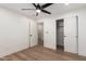 Bedroom with hardwood floors, ceiling fan, walk-in closet and fresh paint at 829 E Desert Park Ln, Phoenix, AZ 85020