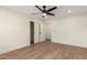 Bedroom with hardwood floors, ceiling fan, closet and fresh paint at 829 E Desert Park Ln, Phoenix, AZ 85020