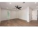 Modern bedroom with ceiling fan, window, and neutral walls at 829 E Desert Park Ln, Phoenix, AZ 85020