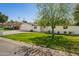 Charming single-story home with a lush green lawn, attached garage, and a welcoming front garden at 829 E Desert Park Ln, Phoenix, AZ 85020