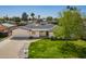 Landscaped front lawn and attached garage accentuate this charming single-story house in a quiet neighborhood at 829 E Desert Park Ln, Phoenix, AZ 85020