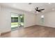 Bright living room with hardwood floors, ceiling fan, and access to the backyard patio at 829 E Desert Park Ln, Phoenix, AZ 85020