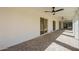 Covered patio featuring ceiling fans and stylish brick flooring at 829 E Desert Park Ln, Phoenix, AZ 85020