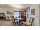 Bright dining room with a chandelier, carpet and a built-in china cabinet at 8500 E Southern Ave # 463, Mesa, AZ 85209