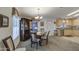 Bright dining room with a chandelier, carpet and a built-in china cabinet at 8500 E Southern Ave # 463, Mesa, AZ 85209