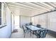 Enclosed sun room with lattice walls, a lattice roof, and outdoor table and chairs on a light tile floor at 8500 E Southern Ave # 463, Mesa, AZ 85209