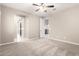 Neutral bedroom with multiple doorways and carpet flooring at 9382 W Louise Dr, Peoria, AZ 85383