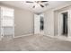 Spacious bedroom with neutral carpet, light walls, and access to walk-in closet at 9382 W Louise Dr, Peoria, AZ 85383