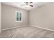 Bedroom with neutral carpet, light walls, and shuttered window at 9382 W Louise Dr, Peoria, AZ 85383