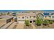 Aerial view of a two-story home featuring a well-manicured yard, a two car garage, and desert landscaping at 9382 W Louise Dr, Peoria, AZ 85383