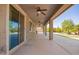 Expansive covered patio area with multiple ceiling fans, perfect for outdoor entertaining at 9382 W Louise Dr, Peoria, AZ 85383