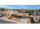 Aerial view of a well-maintained single-story home showcasing its landscaped front yard and a long driveway at 947 N Saffron --, Mesa, AZ 85205