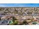 Scenic aerial view of a suburban neighborhood with mature trees and private backyard pools in Phoenix, Arizona at 947 N Saffron --, Mesa, AZ 85205