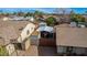 Backyard view of a gated area, sheds, and low maintenance landscaping at 947 N Saffron --, Mesa, AZ 85205