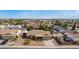 An aerial view showcases a charming single-story residence complete with a well-maintained front yard and lengthy driveway at 947 N Saffron --, Mesa, AZ 85205