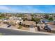 Neighborhood view of single-story home with desert landscaping and a blue sky background at 947 N Saffron --, Mesa, AZ 85205