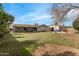 Expansive backyard with lush lawn and covered patio area, ideal for entertaining guests at 947 N Saffron --, Mesa, AZ 85205