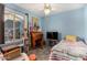 Bedroom featuring a gray carpet, blue walls, a desk, a bed and a window with blinds at 947 N Saffron --, Mesa, AZ 85205