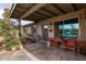 Charming front porch with decorative seating and potted plants, adding to the home's curb appeal at 947 N Saffron --, Mesa, AZ 85205