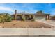 Charming single-story home featuring a well-maintained yard and a two-car garage at 947 N Saffron --, Mesa, AZ 85205