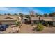 A neatly maintained front yard featuring desert landscaping and a gated driveway at 947 N Saffron --, Mesa, AZ 85205