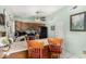 Kitchen with breakfast bar, stainless steel sink, black appliances, and wood cabinets at 947 N Saffron --, Mesa, AZ 85205