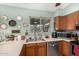 Close up on kitchen sink with stainless steel appliances and view to backyard at 947 N Saffron --, Mesa, AZ 85205